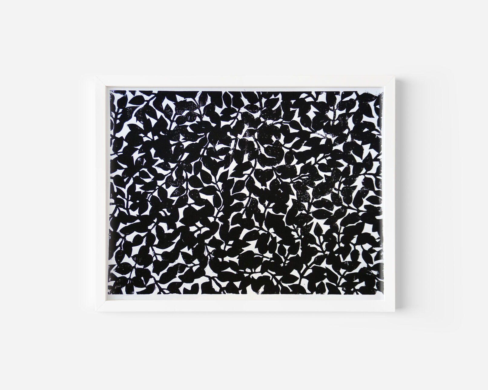 handprinted black and white linocut print of plant patterns