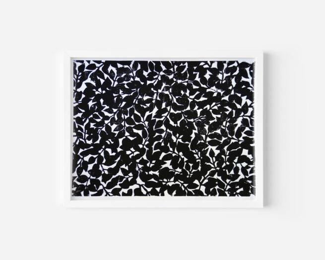 handprinted black and white linocut print of plant patterns